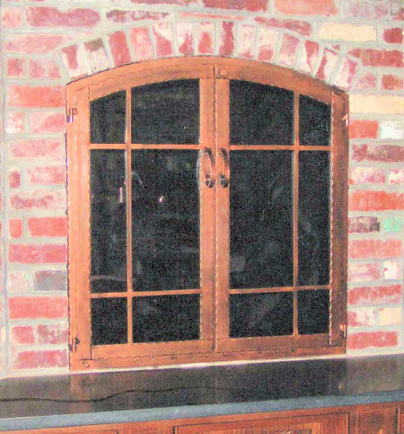 Hammered Steel  Window-pane Arch  (Hammered Steel) All antique copper,  hammered steel with twin doors, smoked glass. Comes with gate mesh spark screens.  Inside fit installation.